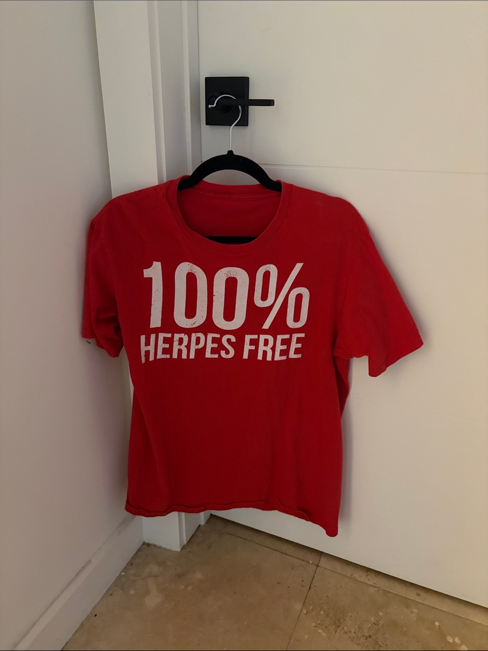 Amazon Red Graphic Tee with White '100% Herpes Free' Print
